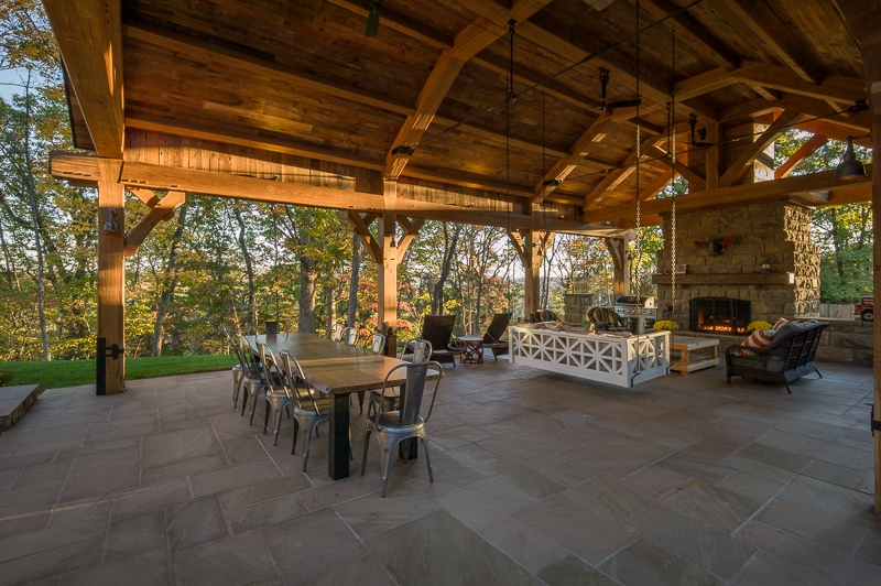white oak timber frame pavilion with outdoor stone fireplace in Virginia